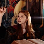 a young girl casting a spell